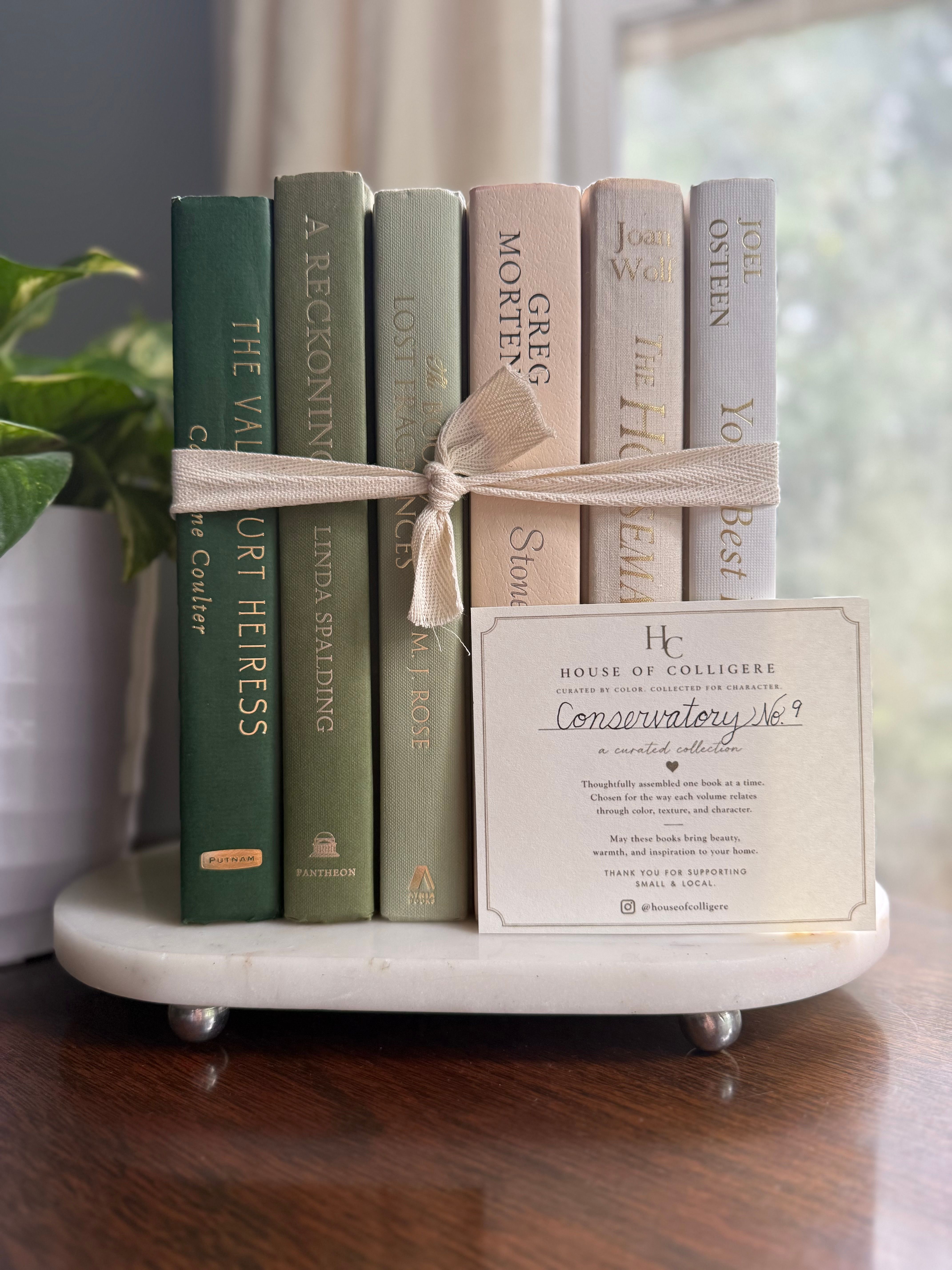 Curated collection of green books ranging from soft sage and olive to deeper botanical tones.