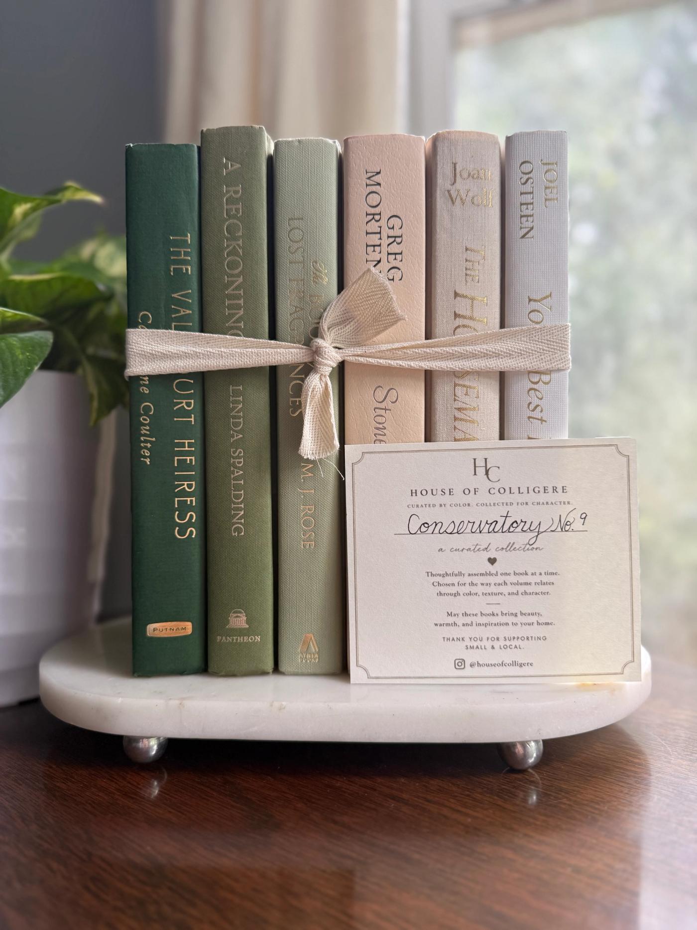 Curated collection of green books ranging from soft sage and olive to deeper botanical tones.