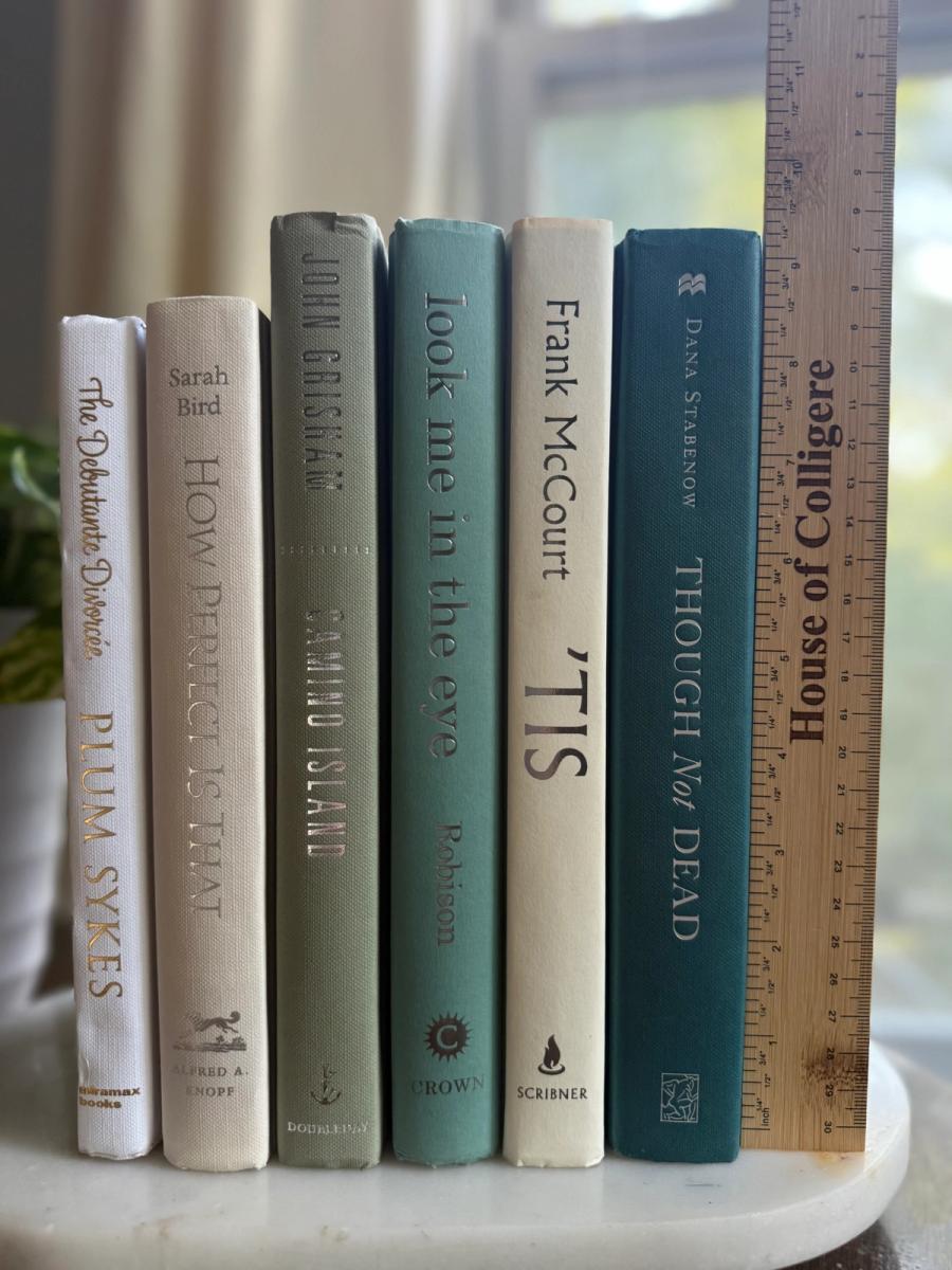 Curated collection of white, pale blue, sand, and soft coastal-neutral books with an airy, sun-faded look.