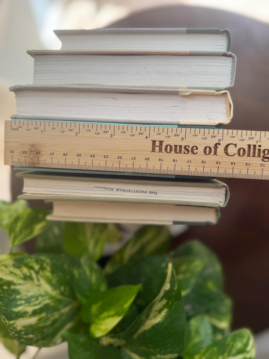Curated collection of soft sage, olive, cream, and muted green books with botanical tones.