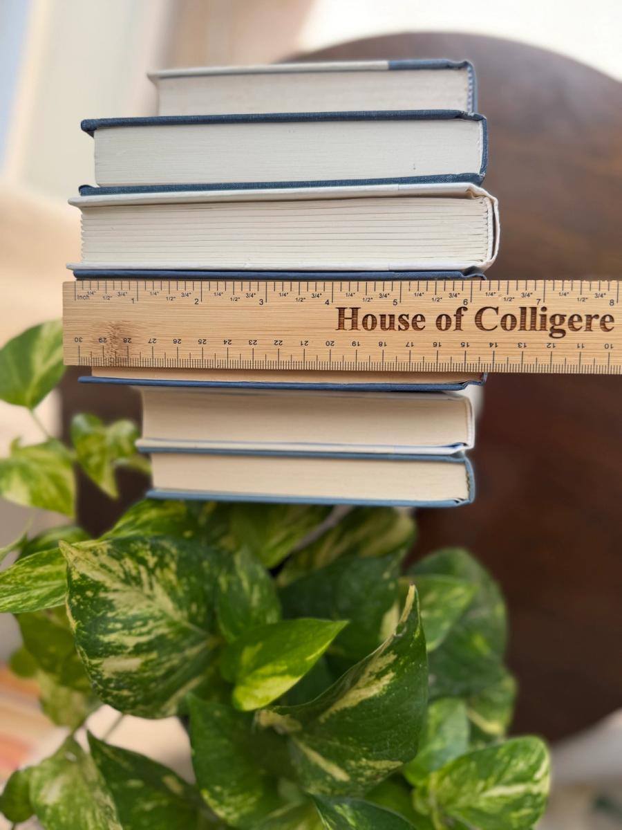 Curated collection of layered blue books ranging from pale coastal blue to deeper ocean tones.
