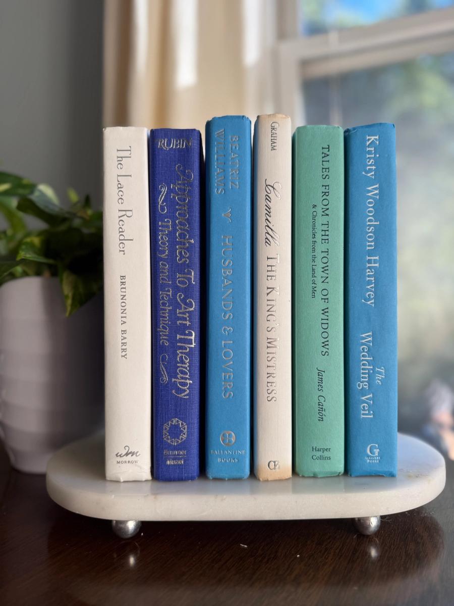 Curated collection of soft blue, aqua, seafoam, and muted coastal-toned books.