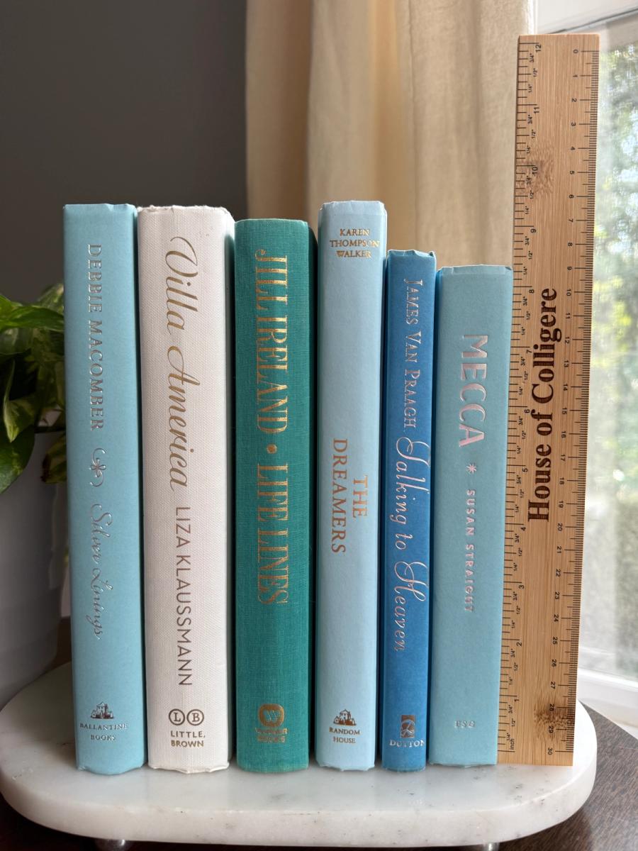 Curated collection of soft blue, aqua, seafoam, and muted coastal-toned books.