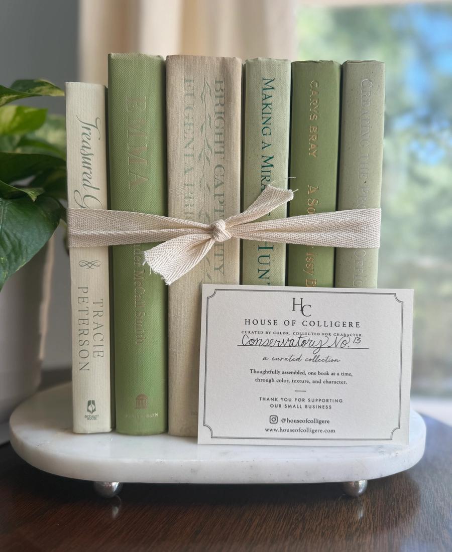 Curated collection of green books ranging from soft sage and olive to deeper botanical tones.