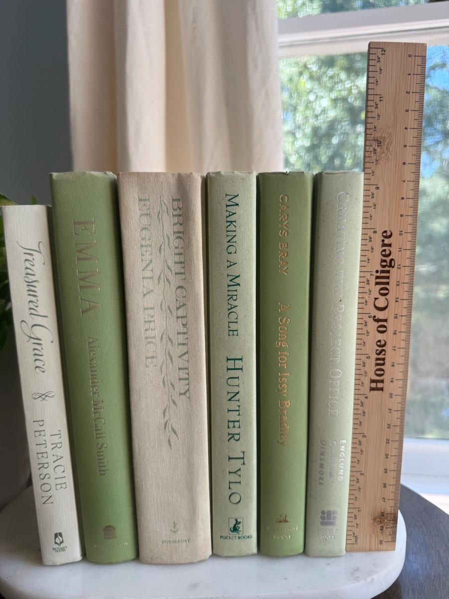 Curated collection of green books ranging from soft sage and olive to deeper botanical tones.