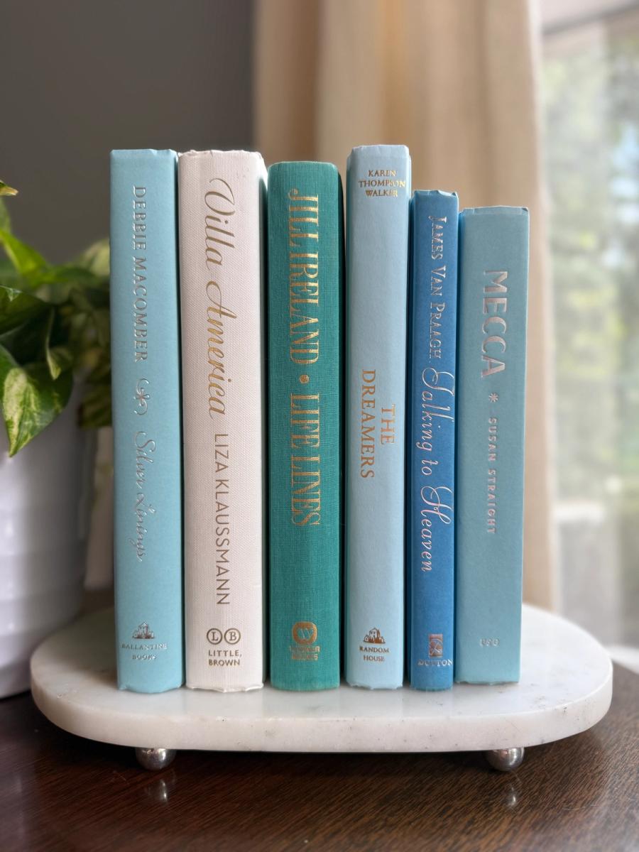 Curated collection of soft blue, aqua, seafoam, and muted coastal-toned books.