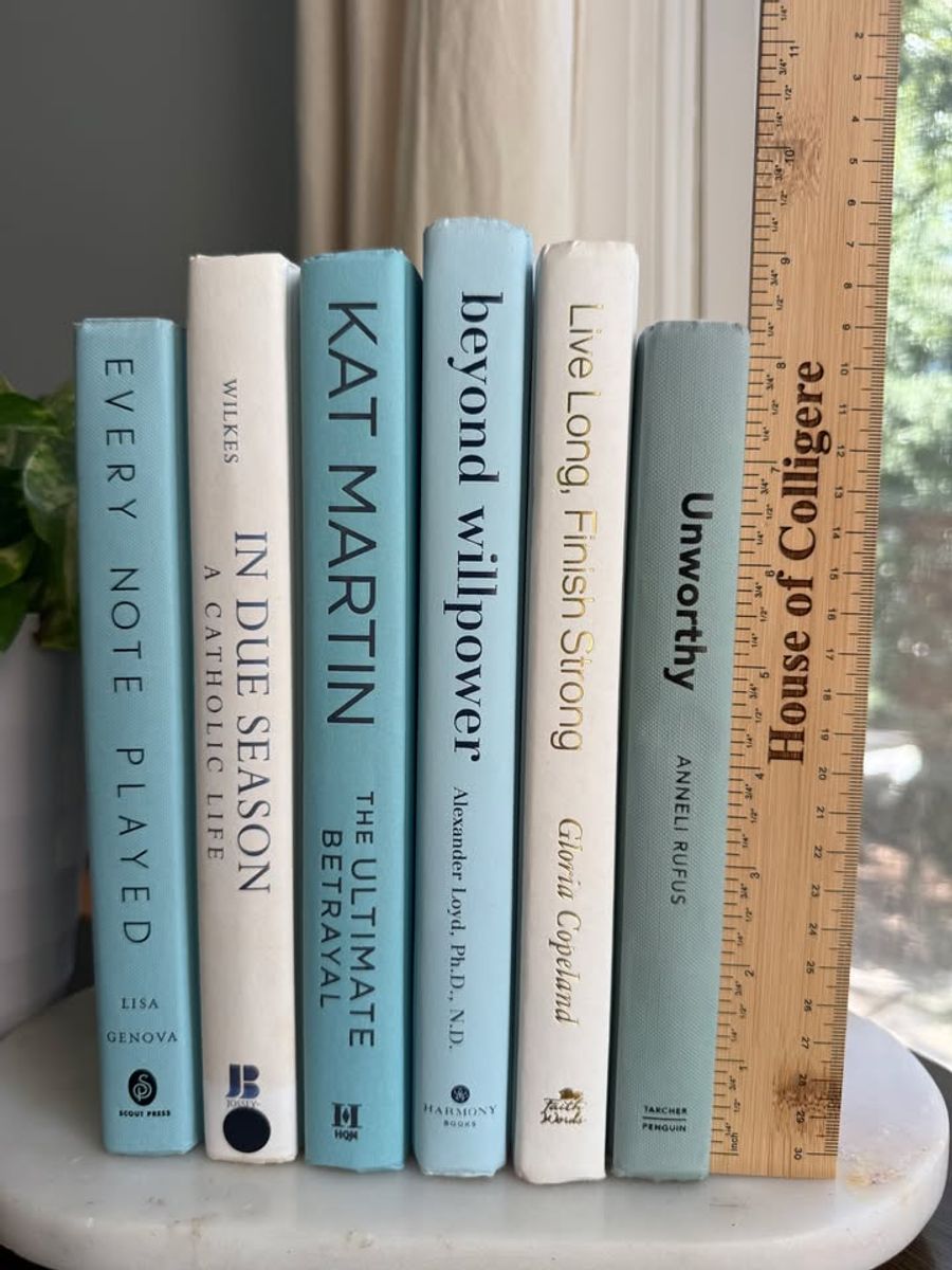 Curated collection of soft blue, aqua, seafoam, and muted coastal-toned books.