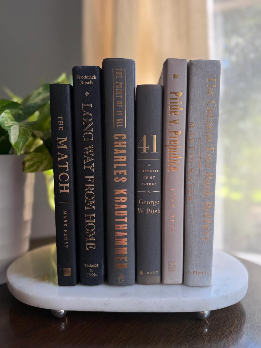 Curated collection of warm brown, olive, tan, and aged neutral books with a traditional library palette.