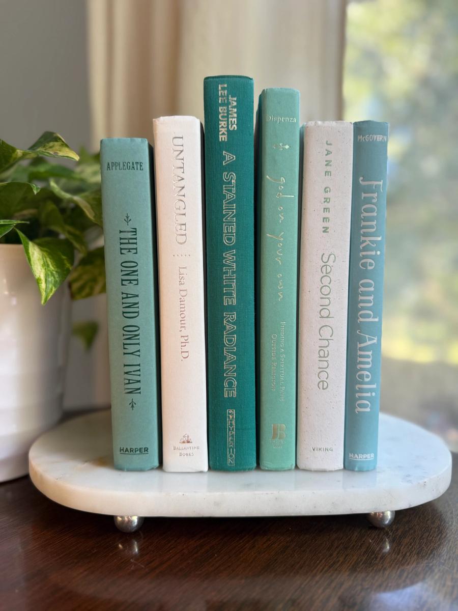 Curated collection of soft blue, aqua, seafoam, and muted coastal-toned books.