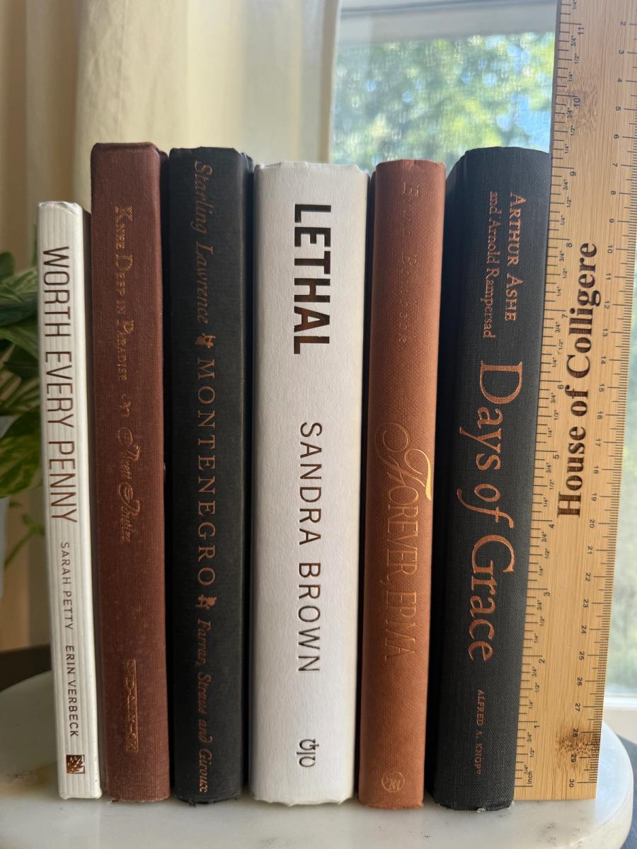 Curated collection of warm brown, olive, tan, and aged neutral books with a traditional library palette.