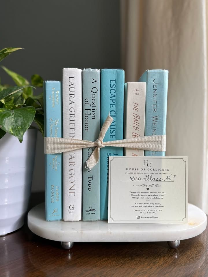 Curated collection of soft blue, aqua, seafoam, and muted coastal-toned books.