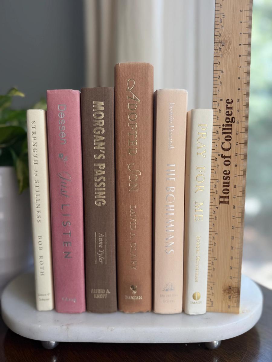 Curated collection of blush, dusty rose, warm taupe, and softly muted neutral books.