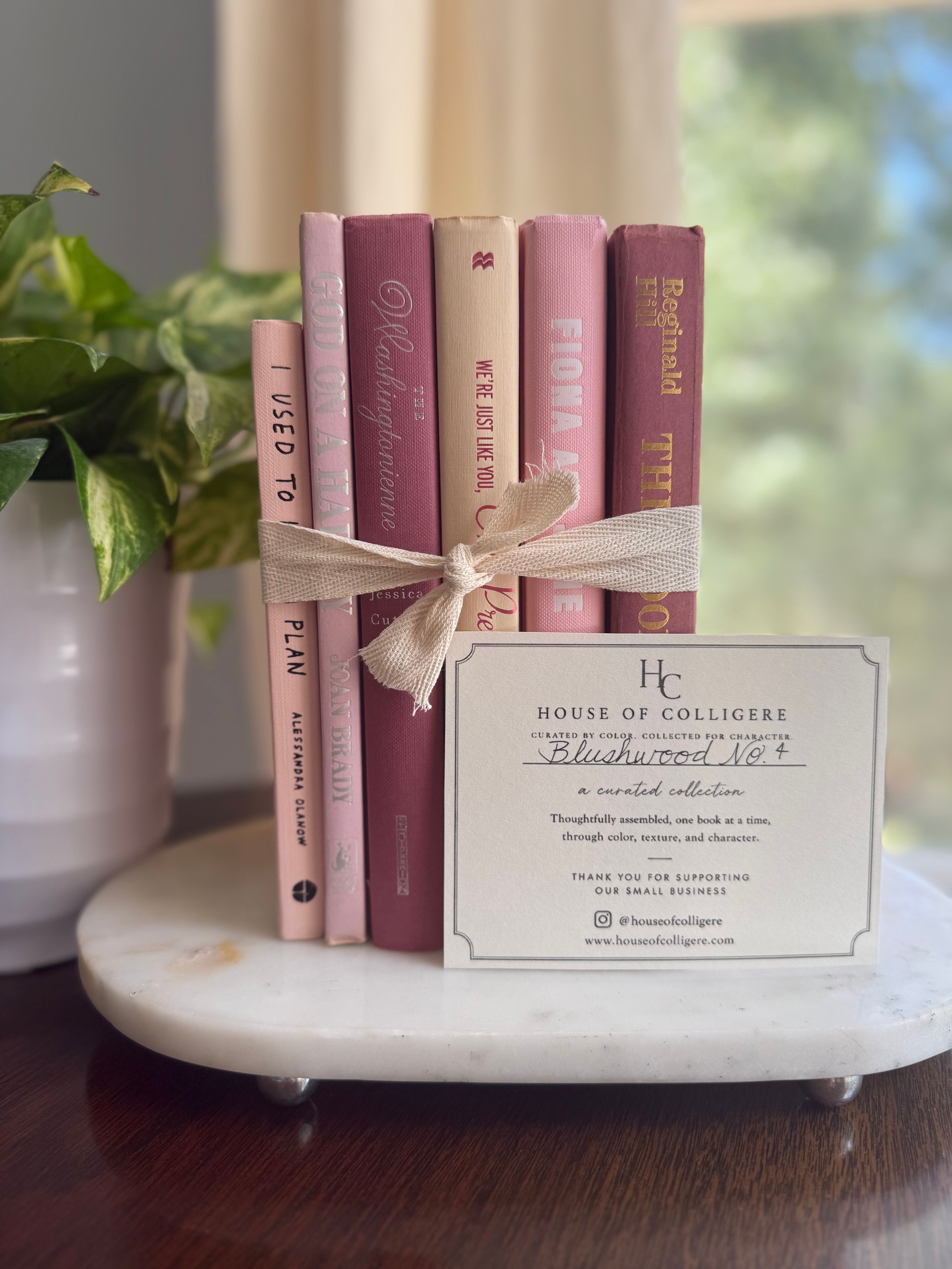 Curated collection of blush, dusty rose, warm taupe, and softly muted neutral books.