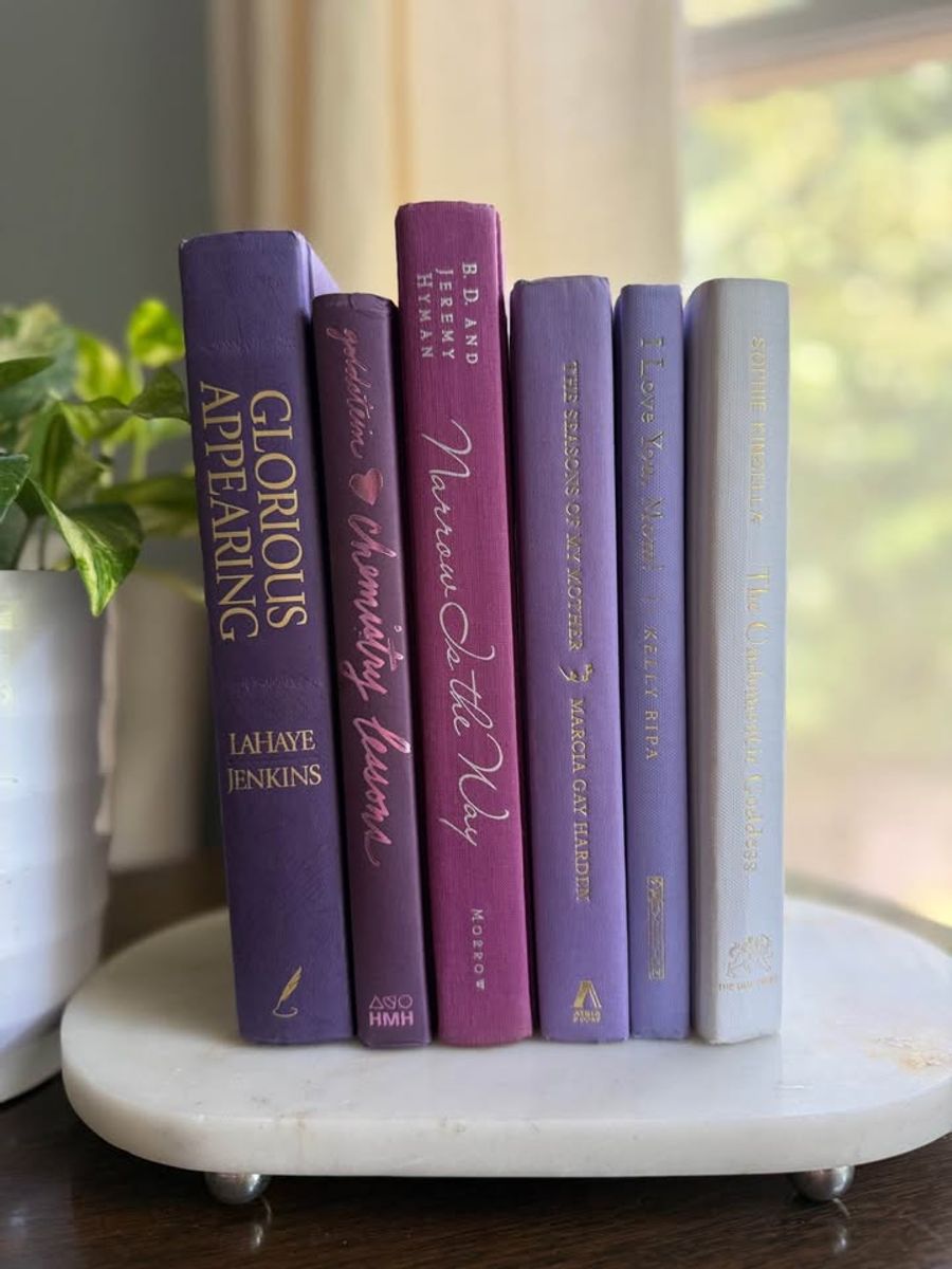Curated collection of lavender, lilac, orchid, and violet books with soft tonal variation and floral-inspired color.