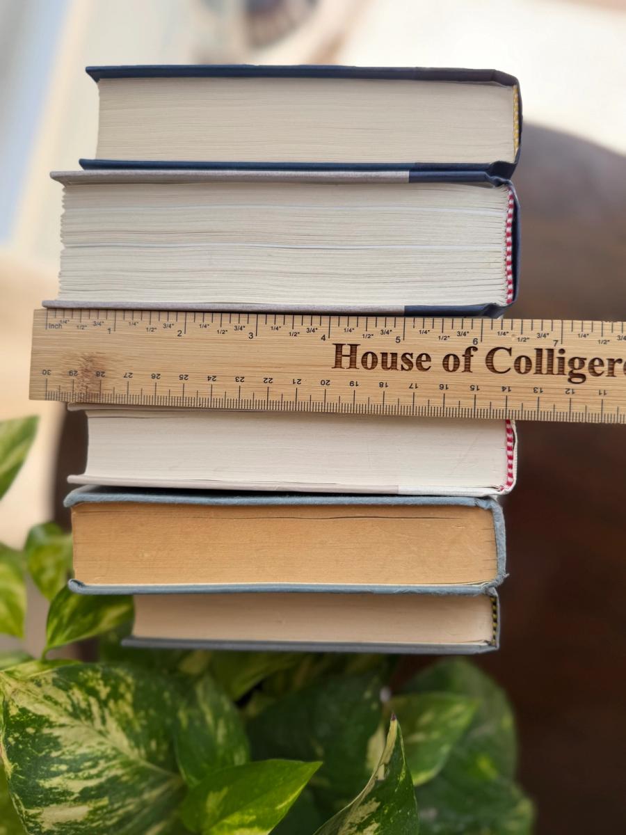 Curated collection of layered blue books ranging from pale coastal blue to deeper ocean tones.