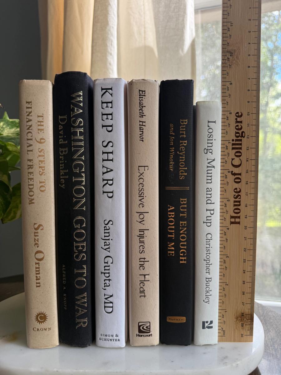 Curated collection of parchment, cream, warm beige, and black books with soft neutral contrast and classic detailing.