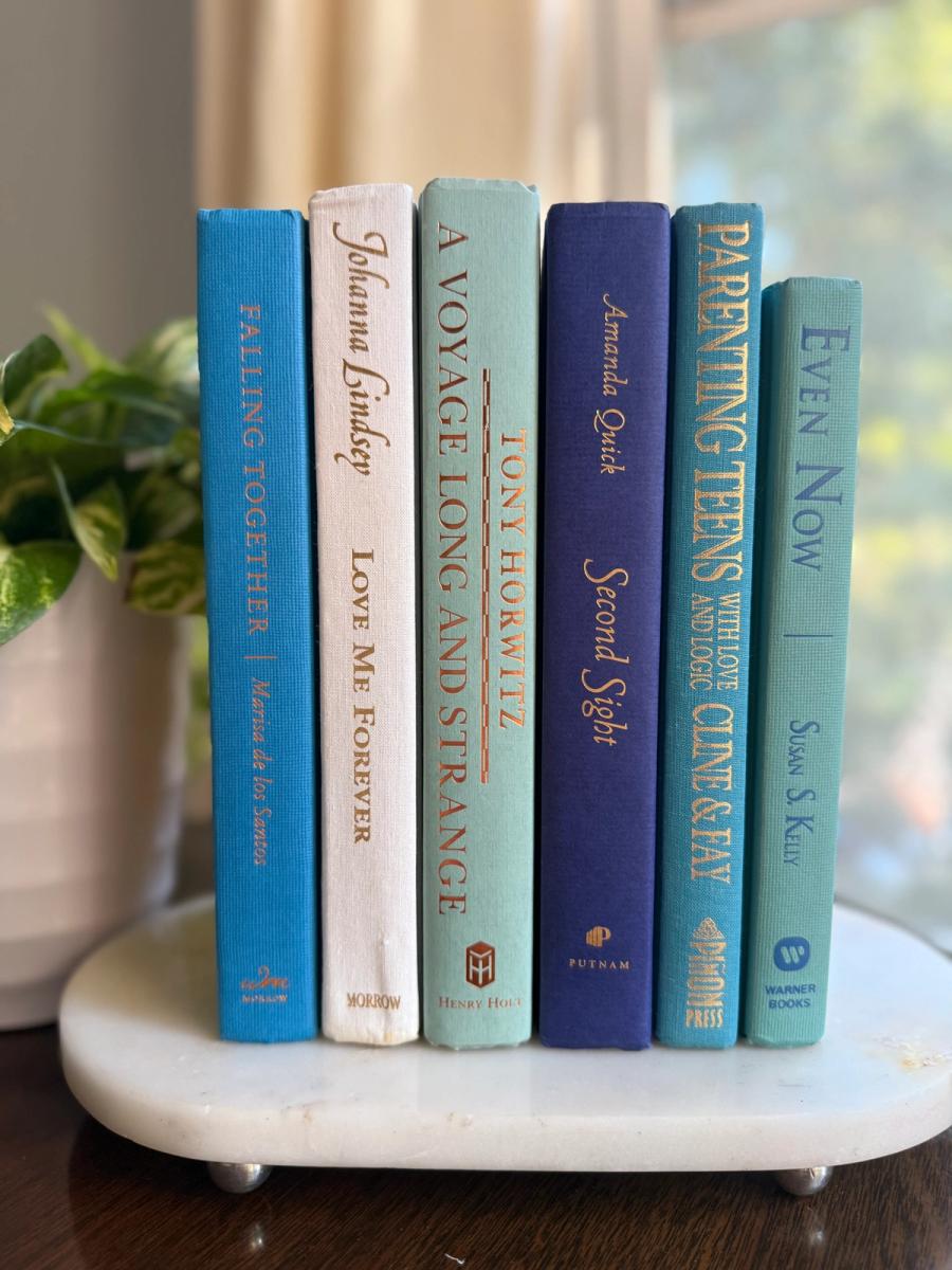Curated collection of soft blue, aqua, seafoam, and muted coastal-toned books.