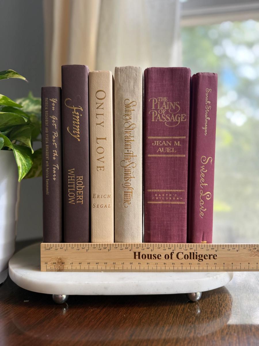 Curated collection of blush, dusty rose, warm taupe, and softly muted neutral books.