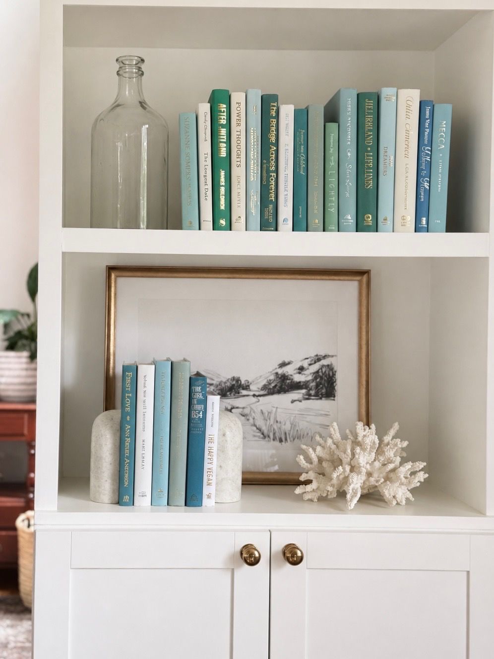 Curated collection of soft blue, aqua, seafoam, and muted coastal-toned books.