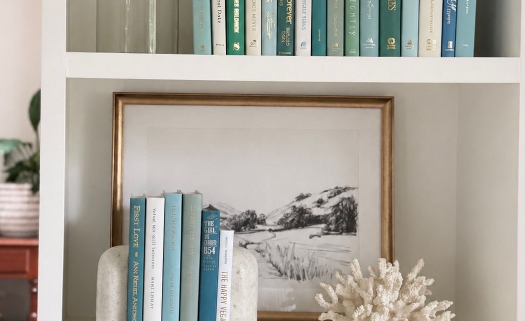 Curated collection of soft blue, aqua, seafoam, and muted coastal-toned books.