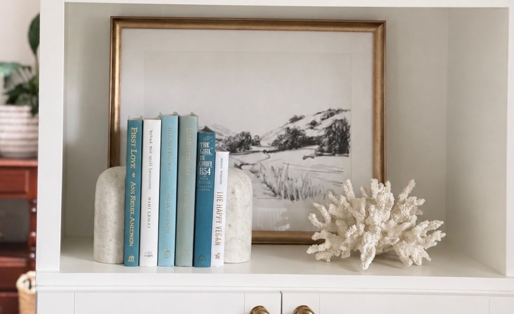 Curated collection of soft blue, aqua, seafoam, and muted coastal-toned books.