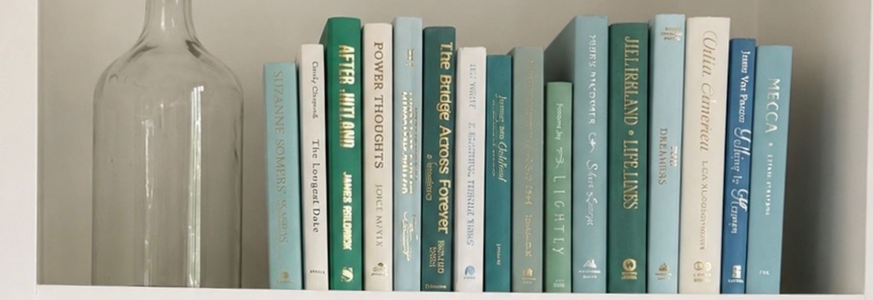 Curated collection of soft blue, aqua, seafoam, and muted coastal-toned books.