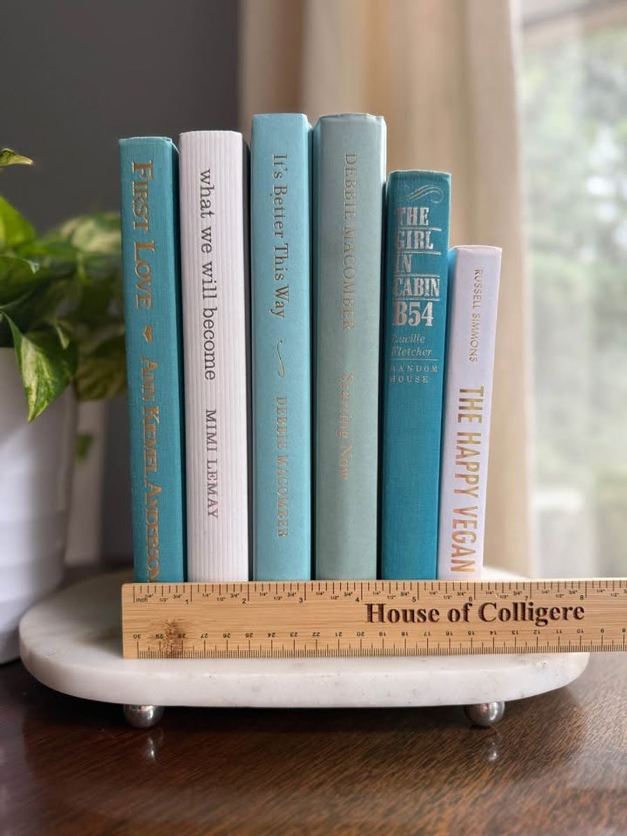 Curated collection of soft blue, aqua, seafoam, and muted coastal-toned books.
