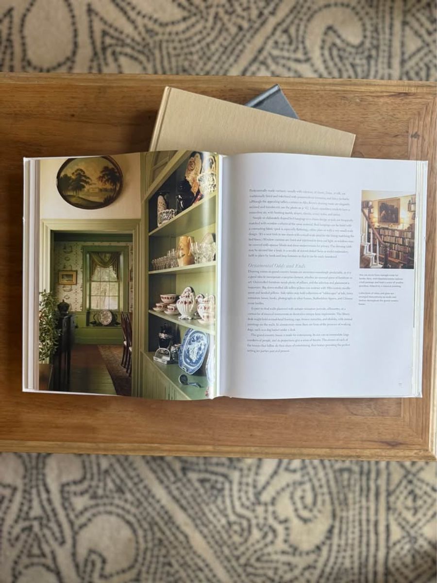Cream, ivory, warm flax, beige, muted blue-gray, soft taupe undertones, linen-like cloth covers, matte woven texture, subtle gold and metallic lettering, understated traditional styling