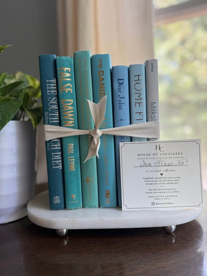 Curated collection of soft blue, aqua, seafoam, and muted coastal-toned books.