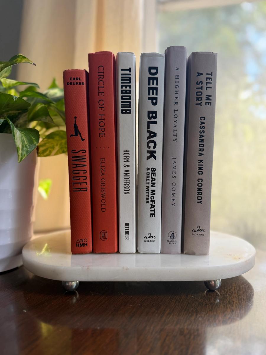 Six curated hardcover books in coral, ivory, soft gray, and muted lavender tones, tied with natural linen ribbon and displayed with a House of Colligere Modernist Edit No. 6 card
