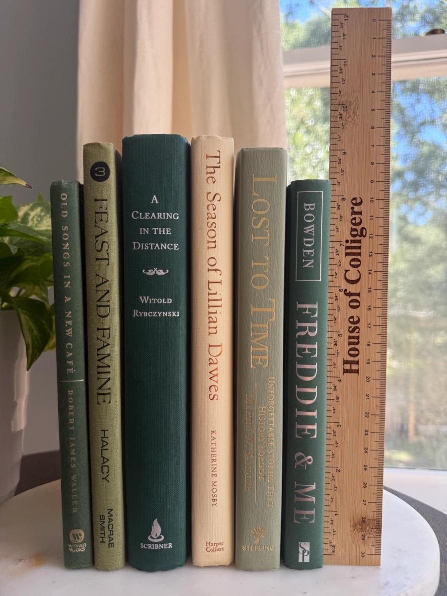 Curated collection of soft sage, olive, cream, and muted green books with botanical tones.