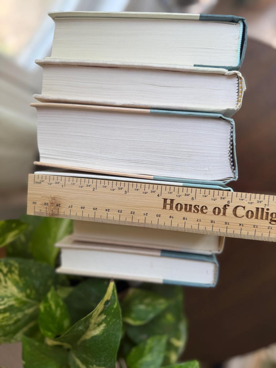 Curated collection of white, pale blue, sand, and soft coastal-neutral books with an airy, sun-faded look.