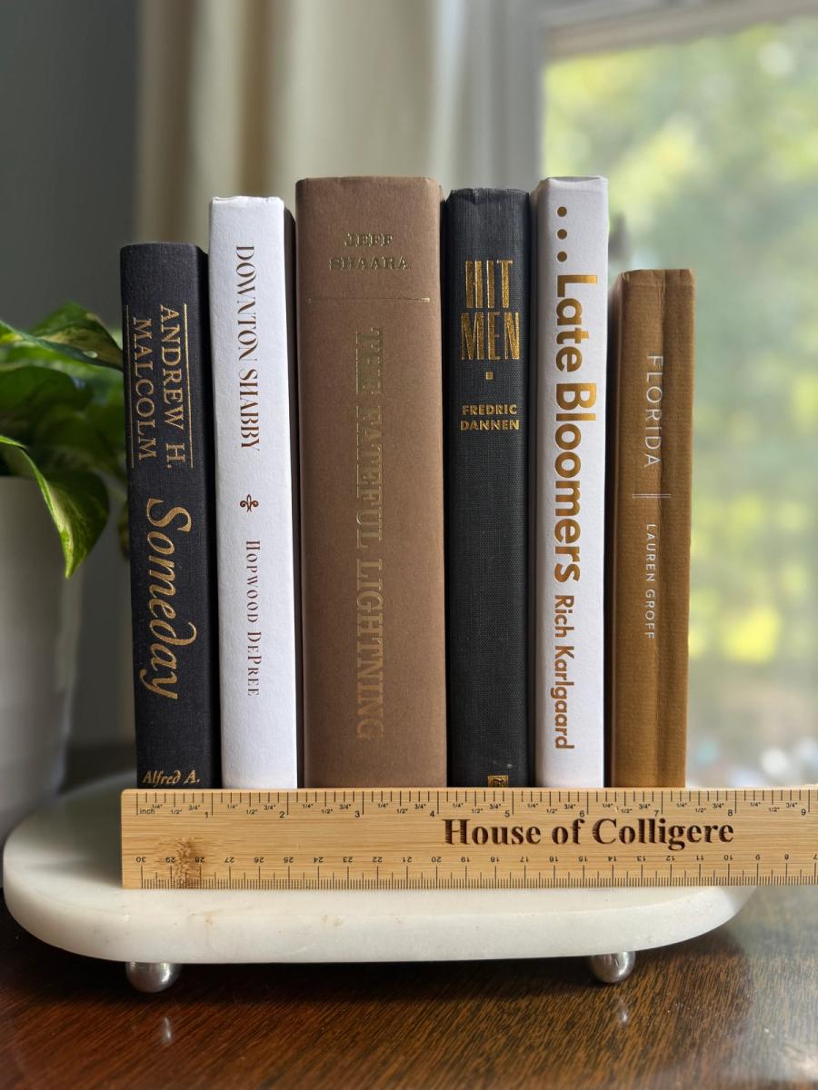 Curated collection of warm brown, olive, tan, and aged neutral books with a traditional library palette.