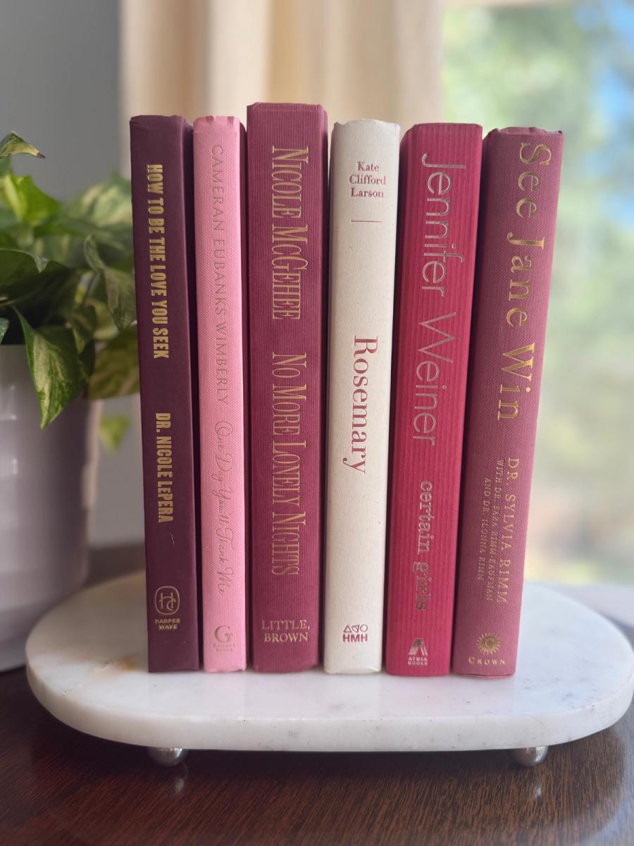 Curated collection of blush, dusty rose, warm taupe, and softly muted neutral books.