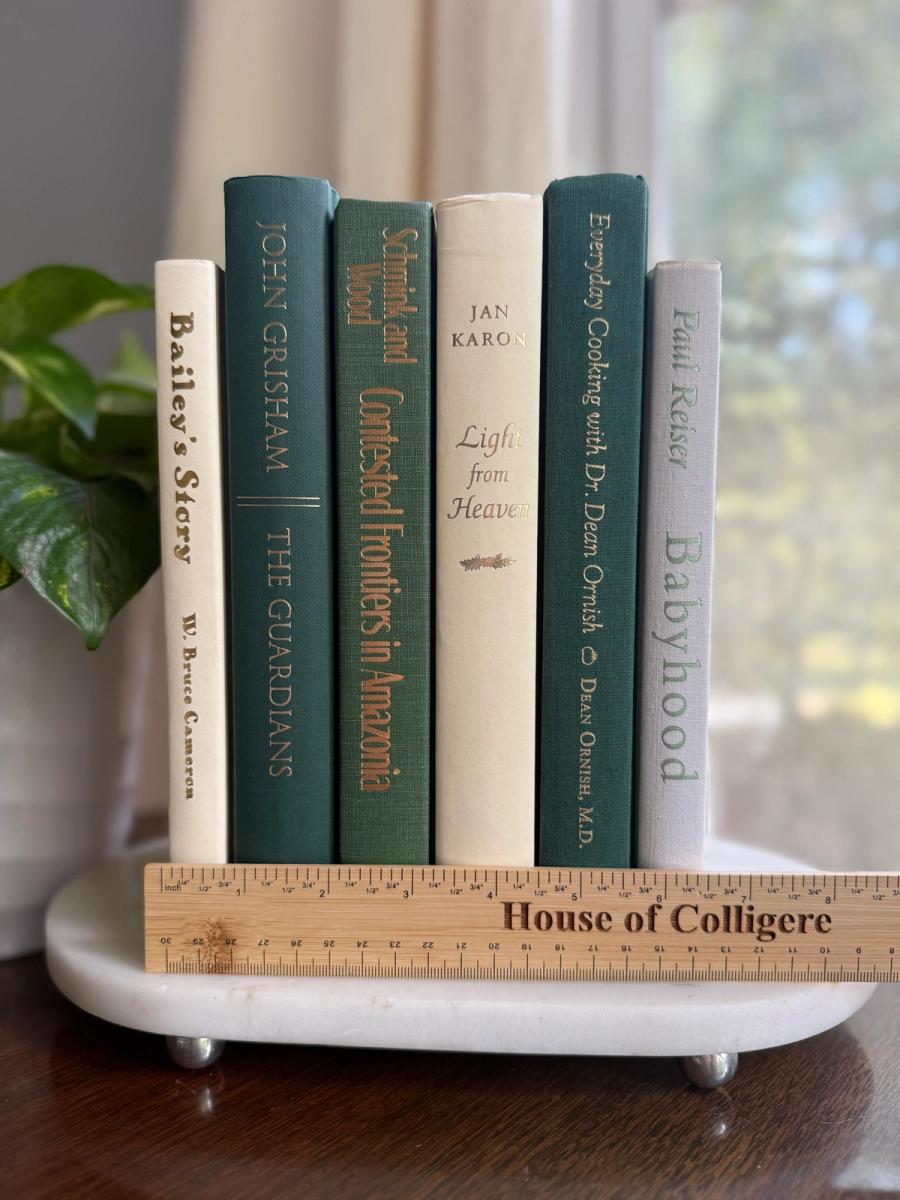 Curated collection of soft sage, olive, cream, and muted green books with botanical tones.