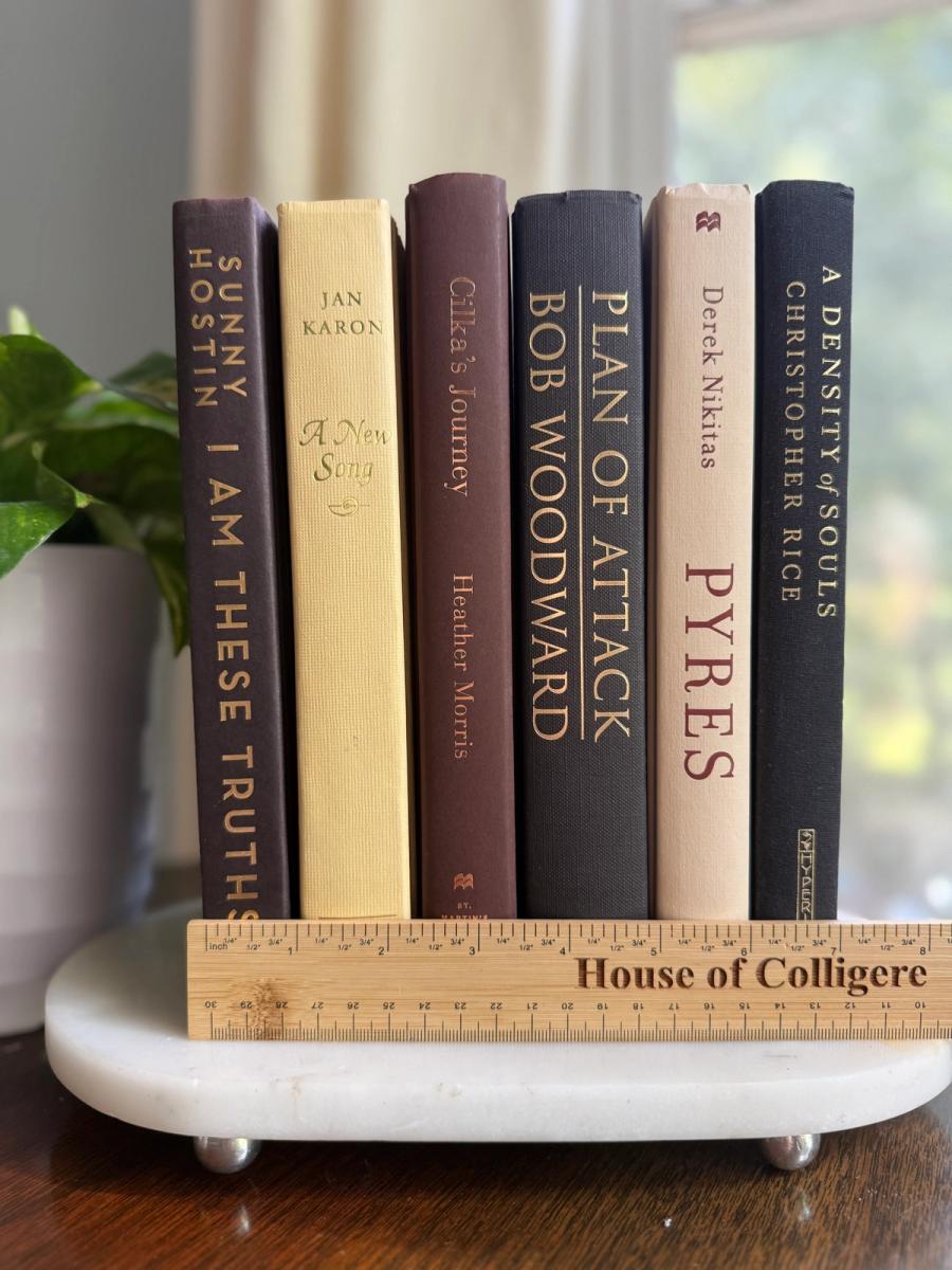Curated collection of warm brown, olive, tan, and aged neutral books with a traditional library palette.