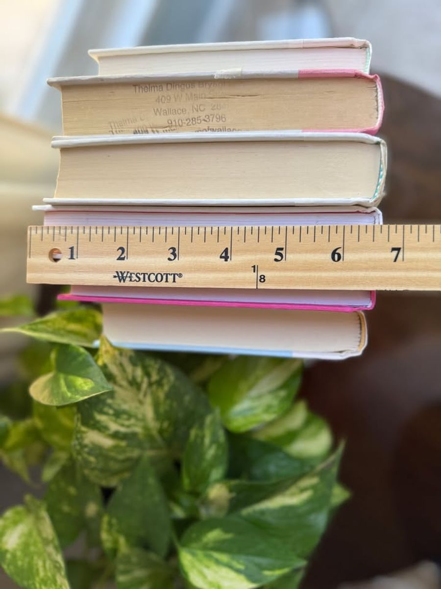 Modernist Edit No. 9 decorative book collection in vivid pink, white, and soft blush tones, tied with neutral linen ribbon and styled on a marble table.