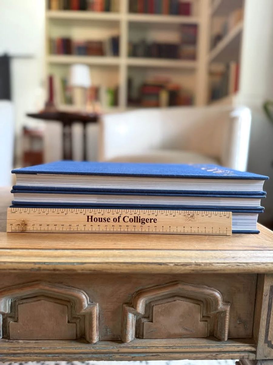 Blue, linen-like cloth covers, matte woven texture, subtle gold and metallic lettering, understated traditional styling