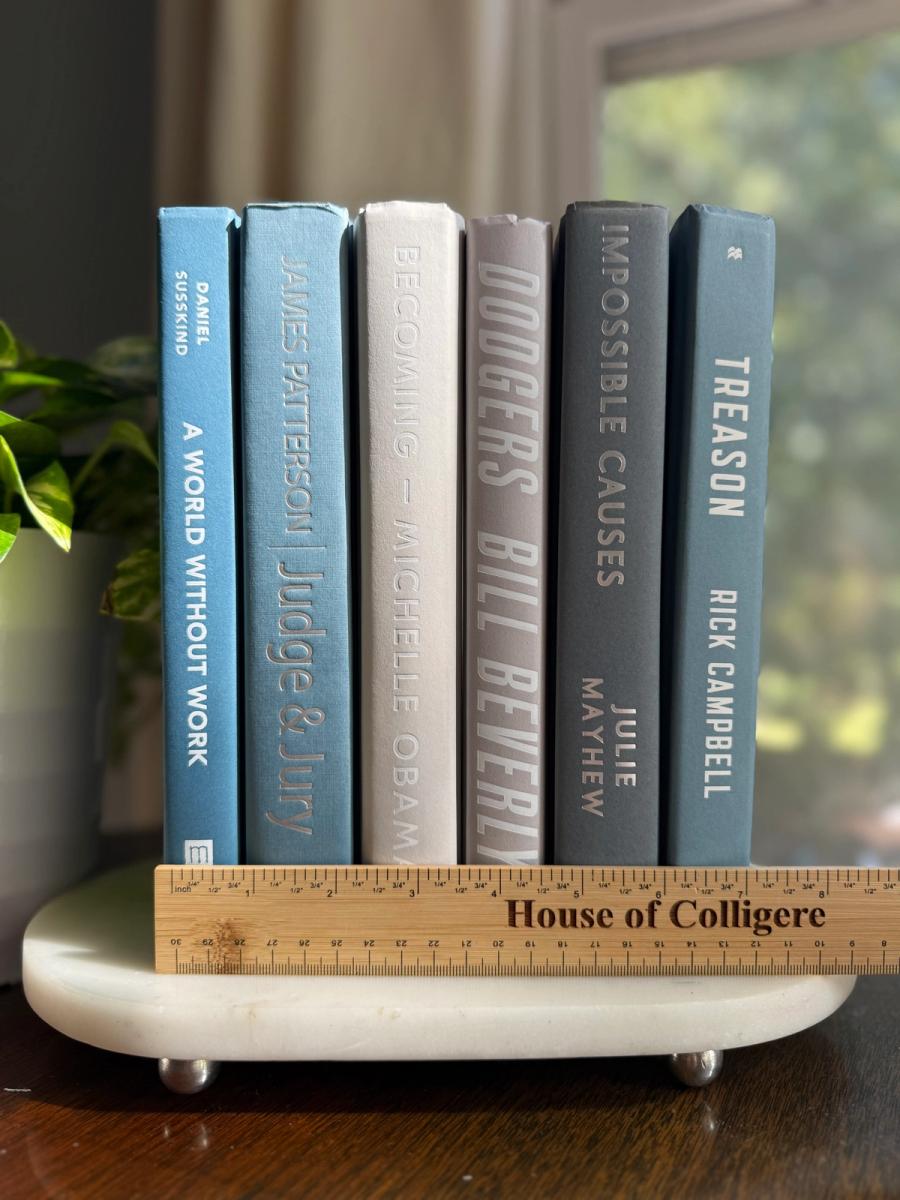 Curated collection of muted blue-gray, slate, charcoal, and softly weathered neutral books.