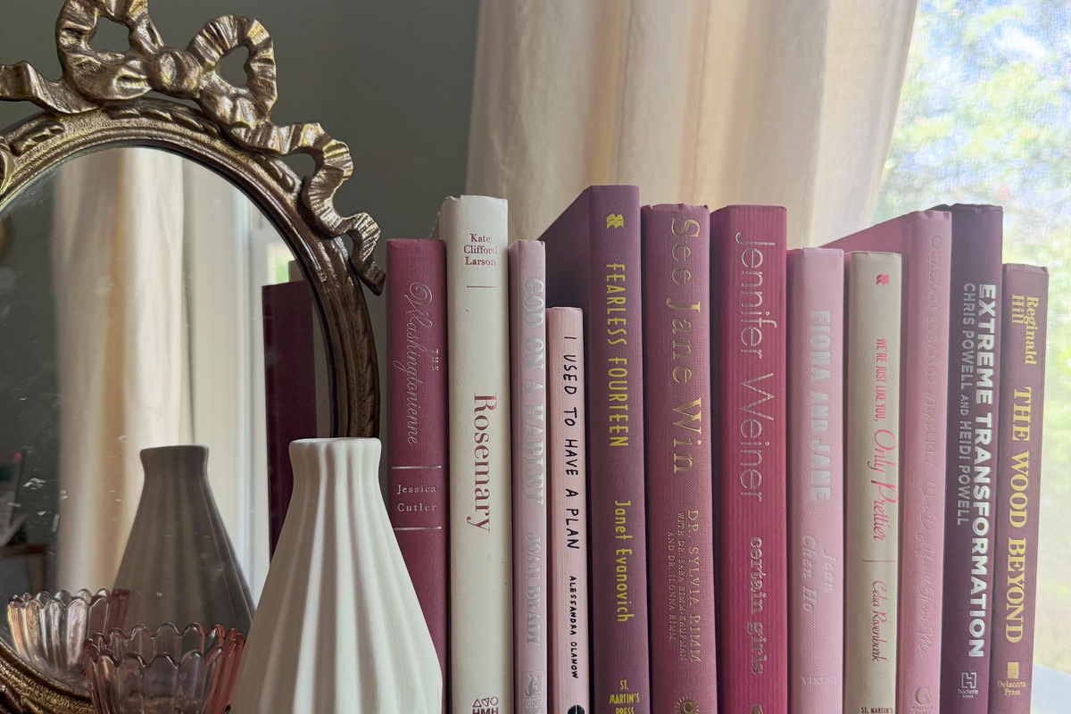 Curated collection of blush, dusty rose, warm taupe, and softly muted neutral books.