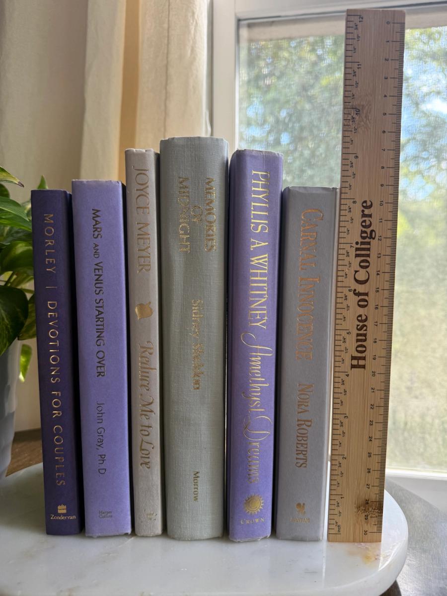 Curated collection of lavender, lilac, orchid, and violet books with soft tonal variation and floral-inspired color.