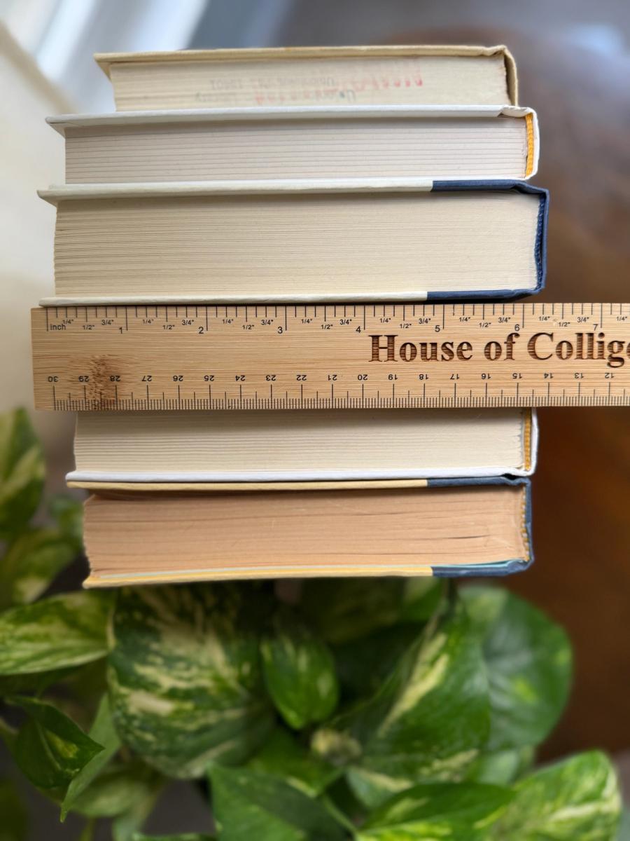 Curated collection of white, pale blue, sand, and soft coastal-neutral books with an airy, sun-faded look.