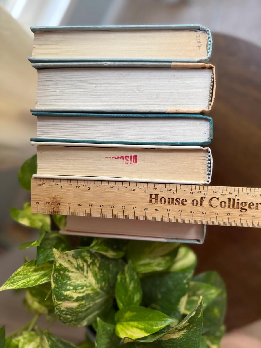 Curated collection of white, pale blue, sand, and soft coastal-neutral books with an airy, sun-faded look.