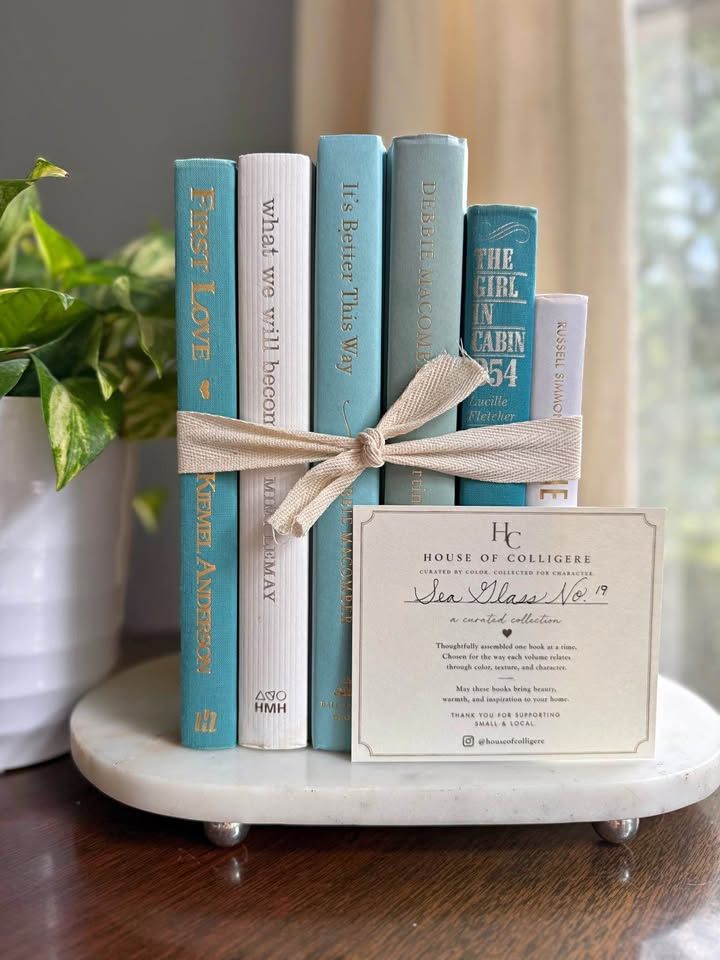 Curated collection of soft blue, aqua, seafoam, and muted coastal-toned books.