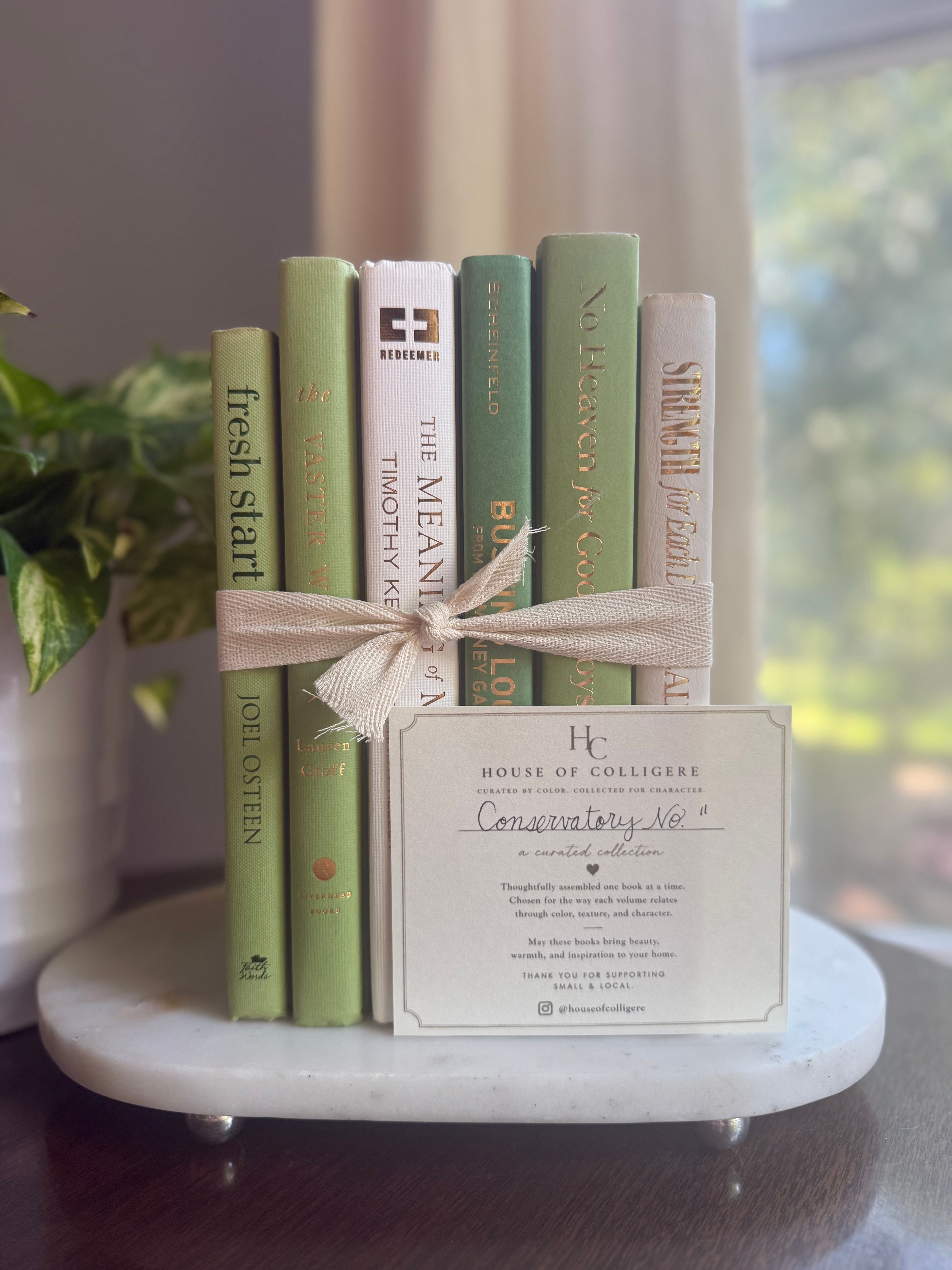 Curated collection of green books ranging from soft sage and olive to deeper botanical tones.