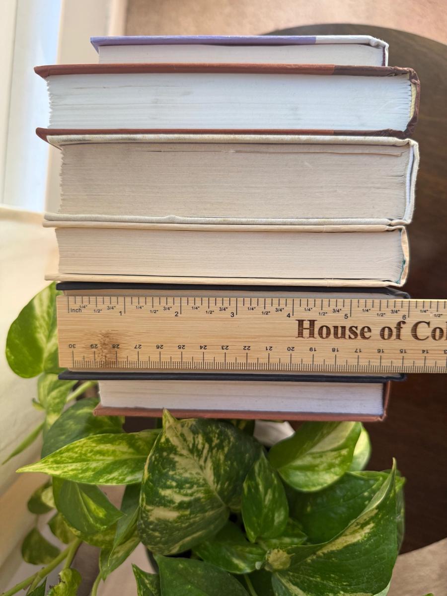 Curated collection of warm brown, olive, tan, and aged neutral books with a traditional library palette.