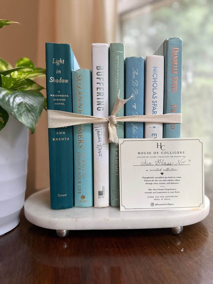 Curated collection of soft blue, aqua, seafoam, and muted coastal-toned books.