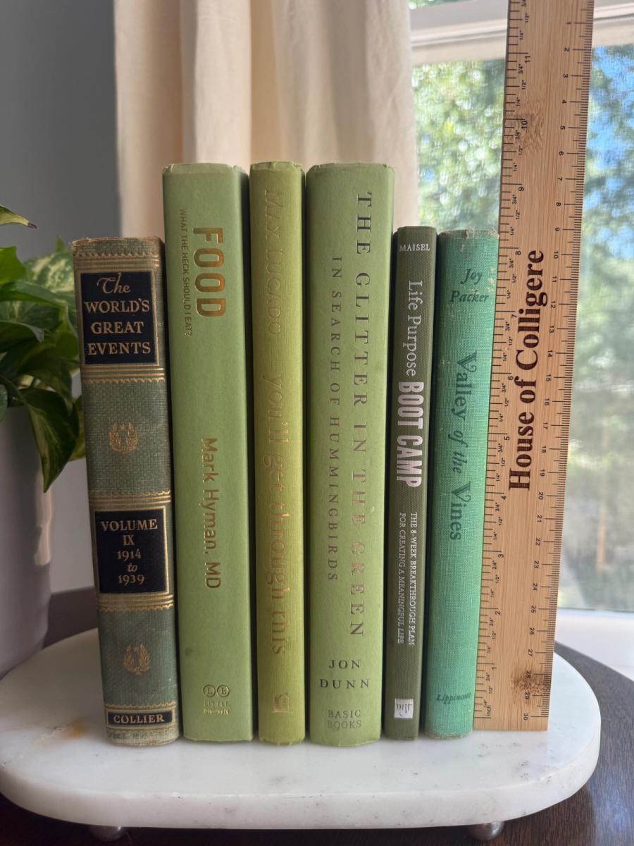 Curated collection of green books ranging from soft sage and olive to deeper botanical tones.