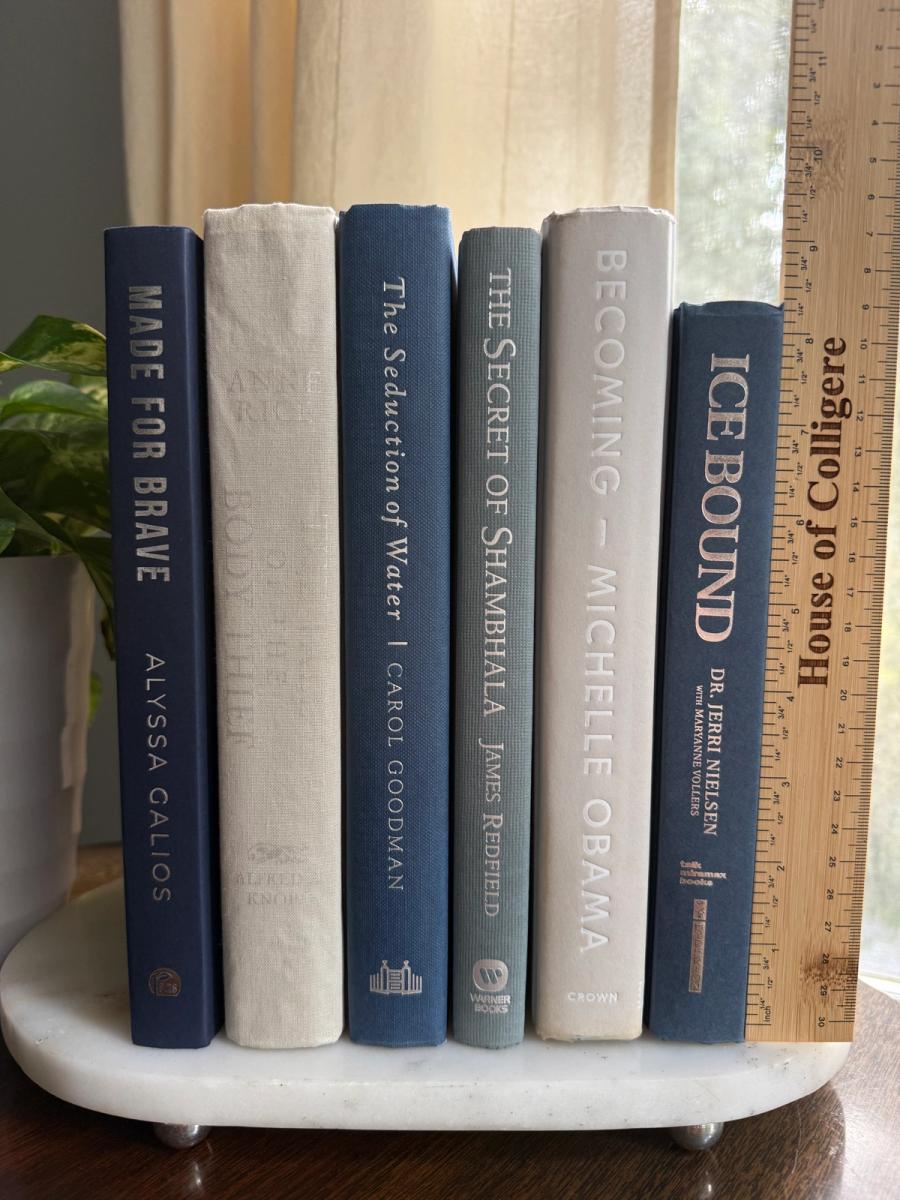 Curated collection of muted blue-gray, slate, charcoal, and softly weathered neutral books.