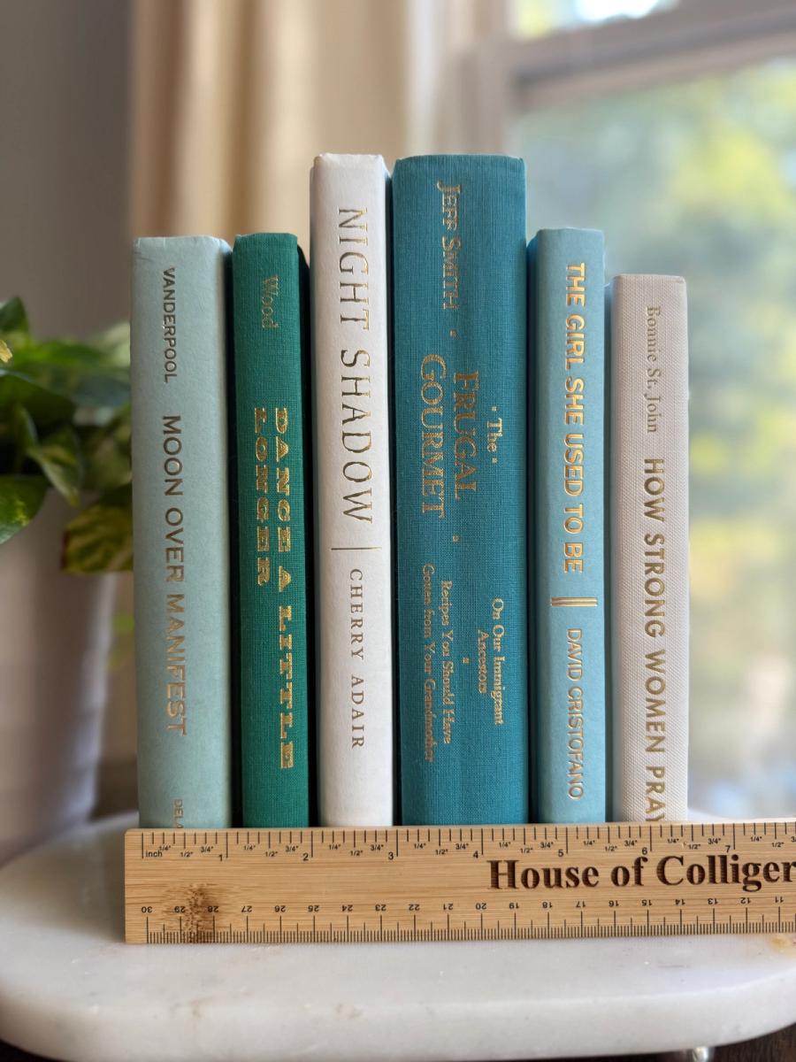 Curated collection of soft blue, aqua, seafoam, and muted coastal-toned books.